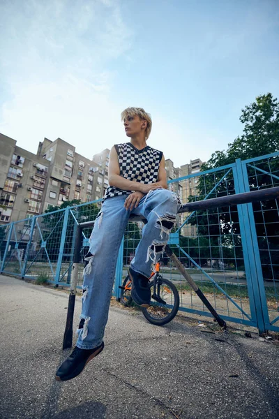 Teenage Boy Sitting Railing Urban Exterior — Fotografia de Stock