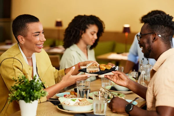 Group Multiracial Friends Sit Restaurant Dinner Table Share Food — 스톡 사진