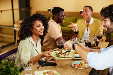 A Group of friends has dinner together in a restaurant.