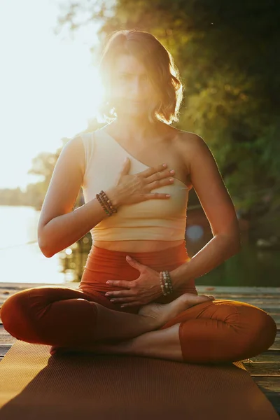 Calm Woman Lotus Pose Sits Dock Practices Yoga Breathing River — ストック写真