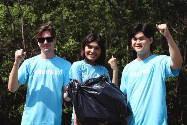 Group Three Volunteers Blue Shirt Hold Garbage Rubbish Bag Raising — Foto Stock