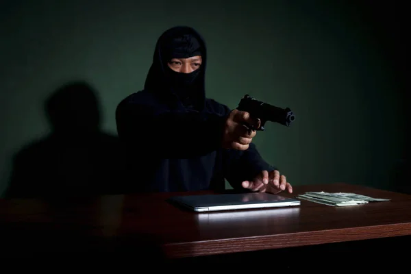 Criminal Man Black Hood Holding Gun Sitting Desk Laptop Computer — Stock Photo, Image