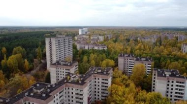 An approaching drone shot of the Concrete high-rise building in Pripyat.