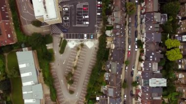 Drone flight along Englewood Road and houses on the sides along it.