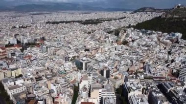 Drone view of the streets of Athens at the foot of Mount Lycabettus.