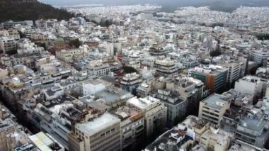 Drone view of the hilly areas of Athens at foot of the mountains before sunrise.