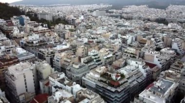 Drone view of the whitewashed houses of Athens before sunrise