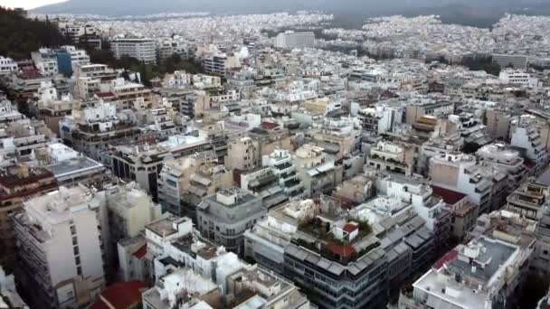 Drone view of the whitewashed houses of Athens before sunrise — Stockvideo