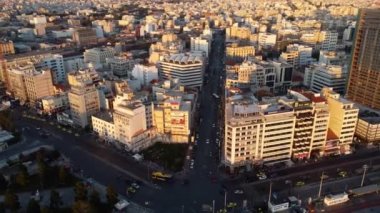 Drone view of the modern buildings of Athens in the rays of the sunset