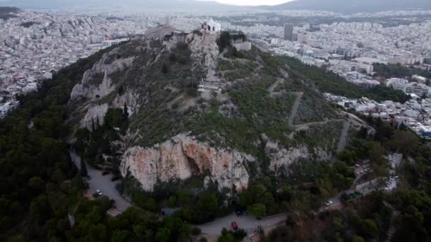 Shooting away from a drone, in the center of the frame is Mount Lycabettus. — Stockvideo