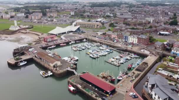 Drone view of the boat stop with the town and the sea in the background. – Stock-video