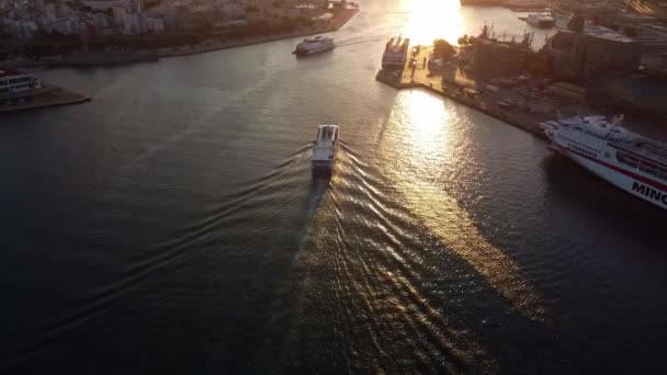 Drone view of the boats sailing at the entrance to the port at sunset in Athens. — Stockvideo