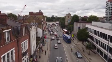 Drone footage of various buildings in London. England. The time is approaching night.