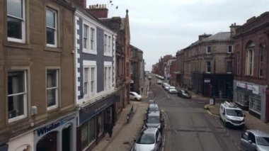 Drone view of a small crossroads in Arbroath. Neat and well maintained street.