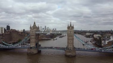 Smooth drone footage of Tower Bridge while cars are moving. Beautiful view of one of the main attractions of London.