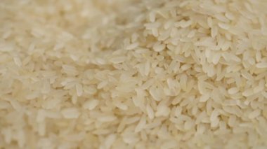 Smooth wiring on the texture of cream-colored long-grain rice. In the frame is a classic Chinese rice.