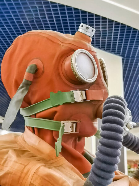 Hypertrophied protective equipment for the face, eyes, lungs and body during the pandemic. Protective rubber set of clothing with air purification system for breathing.