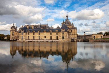 Heavenly landscape over Chateau Chantilly is an object of cultural and historical heritage of France. Castle was built as fortress in the commune of Chantilly, department of Oise. Conde Museum,  clipart