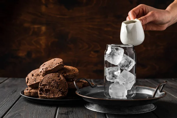 Making Iced Coffee Empty Glass Ice Cubes Hand Holding Milk — Fotografia de Stock