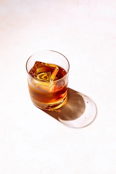 Whiskey Bourbon Rocks Glass Big Ice Cube Shot Hard Light Stock Photo