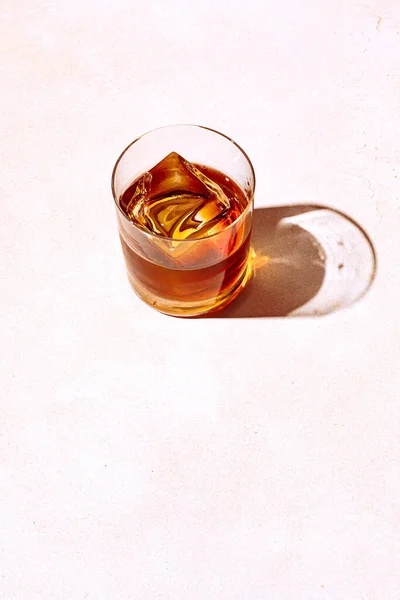 Whiskey Bourbon Rocks Glass Big Ice Cube Shot Hard Light Stock Photo