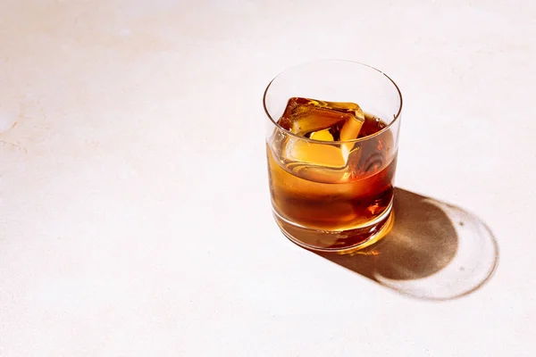 Whiskey Bourbon Rocks Glass Big Ice Cube Shot Hard Light Royalty Free Stock Images