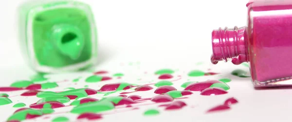 Pink and Green Spilled Nail Polish on White Background — Stock Photo, Image