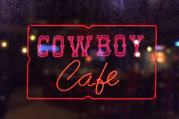 Cowboy Café Neon Sign Ventana Lluviosa —  Fotos de Stock