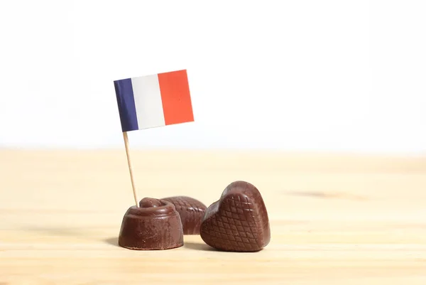 French Chocolate Truffles With French Flag on Table With White