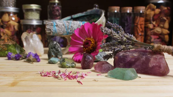 Dried Flowers and Crystal Chakra Stones on Meditation Altar Shallow DOF