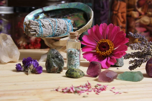 Dried Flowers and Crystal Chakra Stones on Meditation Altar Shallow DOF