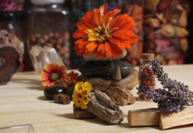 Flowers and Incense Cone With Palo Santo Sticks on Meditation Altar
