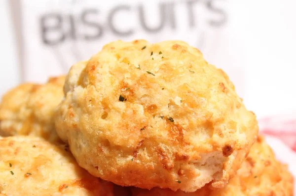 Garlic Cheese Biscuits With Biscuit Sign in Background Shallow DOF