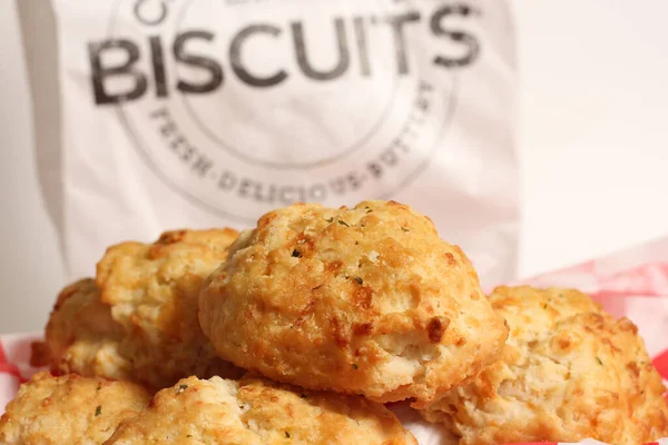 Garlic Cheese Biscuits With Biscuit Sign in Background Shallow DOF