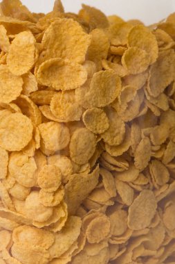 Mısır gevreği yığını arka planda. Doldurulmuş çerçeve fotokopi alanı duvar kağıdı dikey çekimini kapat