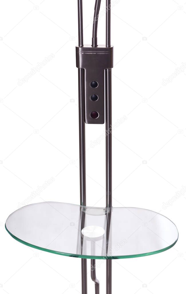 glass table shelf of a dark black metallic uplighter torchiere floor lamp isolated on white background