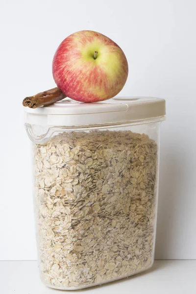 Oatmeal Flakes Plastic Food Container Jar White Lid Red Apple — Stock Photo, Image