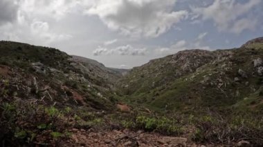 Time lapse video of a col in Parnitha mountain in Greece with clouds passing by at the sky. No edit at the video,original file.