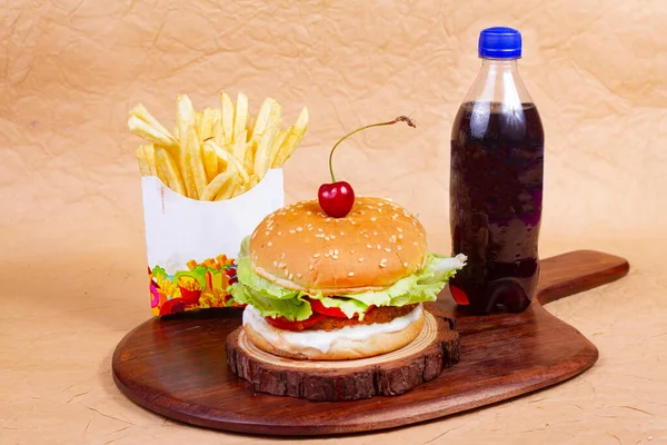 Juicy veg burger, hamburger or cheeseburger with one veg patties, with sauce sauce, french fries and cold drink. Concept of American fast food. Copy space