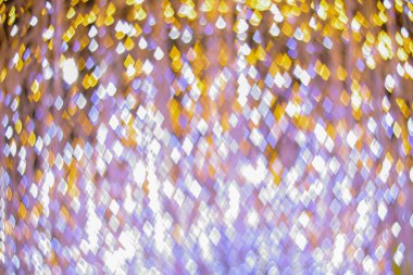 Yeni yılı kutlamak için Noel ışıkları tarafından oluşturulan bulanık bokeh arka plan. Güzel Noel ışıkları arka planı ve arka planı her tasarım ya da Noel tebrik kartı için kullanılabilir..