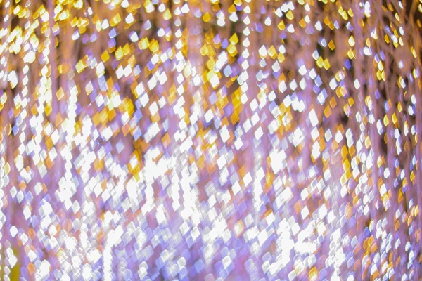 Yeni yılı kutlamak için Noel ışıkları tarafından oluşturulan bulanık bokeh arka plan. Güzel Noel ışıkları arka planı ve arka planı her tasarım ya da Noel tebrik kartı için kullanılabilir..