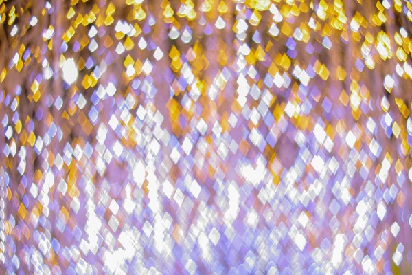 Yeni yılı kutlamak için Noel ışıkları tarafından oluşturulan bulanık bokeh arka plan. Güzel Noel ışıkları arka planı ve arka planı her tasarım ya da Noel tebrik kartı için kullanılabilir..