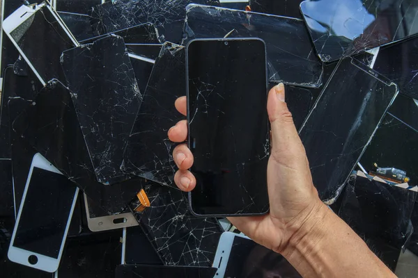 Smartphones and phone screens that are damaged by usage are gathered to be recycled for valuable minerals because e-waste contains valuable minerals in the device and must be extracted