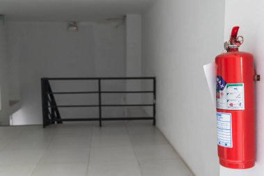 Chiang Mai Thai 24 February 2021 Red fire extinguishers are installed on the walls in high visibility areas or near the building's entrances and exits for easy access in the event of a fire.