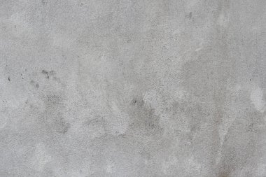 Beton yüzeyin arka planı beton duvardaki deseni ve çatlakları gösteriyor. Bir süre sonra beton duvar ısı ve titreşim nedeniyle çatlıyor..
