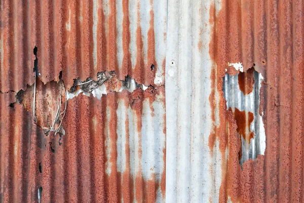 Rust that corrosion  metal surfaces causes strange colors. The surface of the metal is rusted, corrosion causes the metal to look old because of the corrosion  rust for a long time.