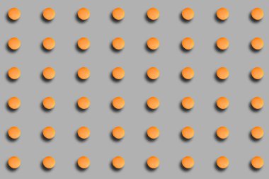 Gri arka planda gölgesi olan turuncu makaronlu bir desen. Fransız tatlısıyla geçmiş. Şablonlar, kapaklar.