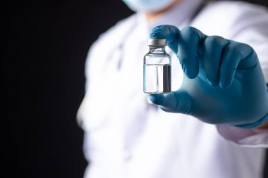 Coronavirus Aşı Kavanozu. Doktor Mavi Aşı Kavanozu. Coronavirus aşısı COVID-19 'un geliştirilmesi ve üretilmesi. , Aşı Coronavirus karşı mücadele kavramı.