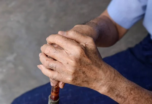 Hand of Southeast Asian elder man. Concept of rheumatoid arthritis, osteoarthritis, or joint pain.