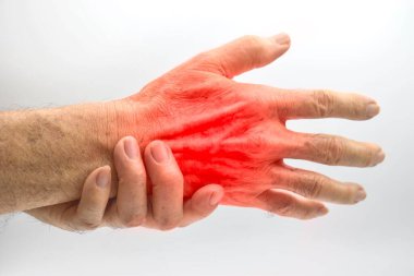 Pain in the hand of Southeast Asian old man. Concept of hand pain, tendinitis and joint problems.